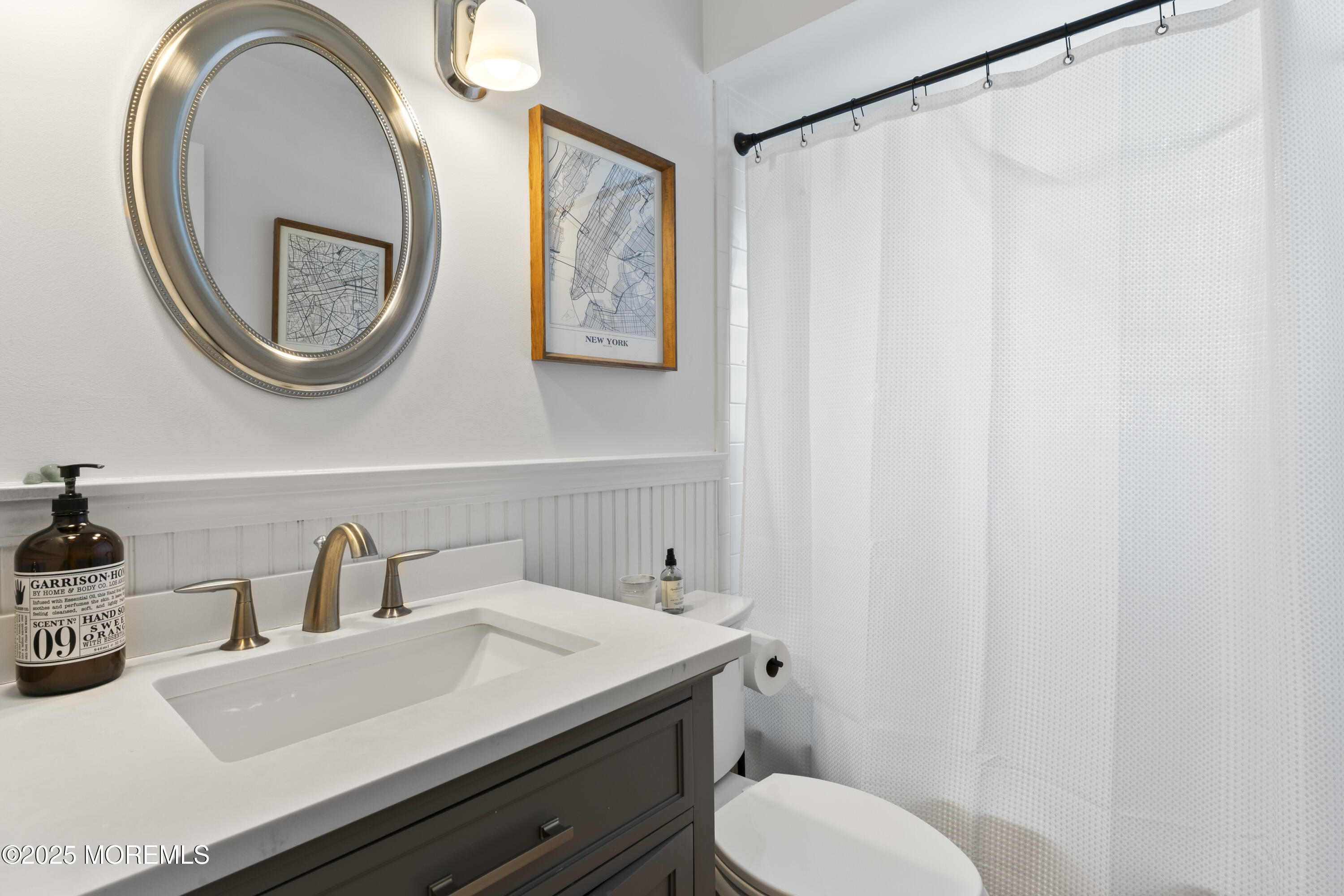 90 River Road Rumson, NJ 07760 - Photo 19 of 32 a bathroom with a sink and a mirror