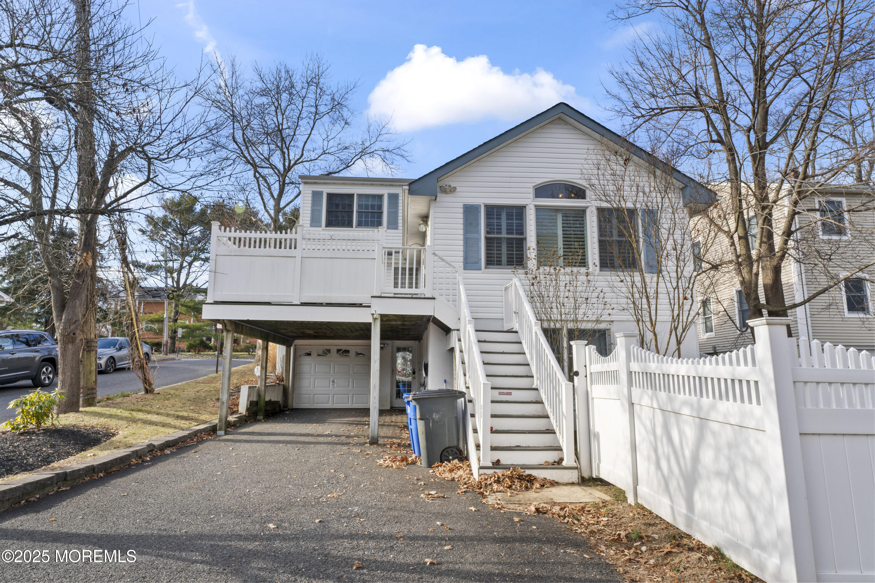90 River Road Rumson, NJ 07760 - Photo 2 of 32 front view of a house with a street