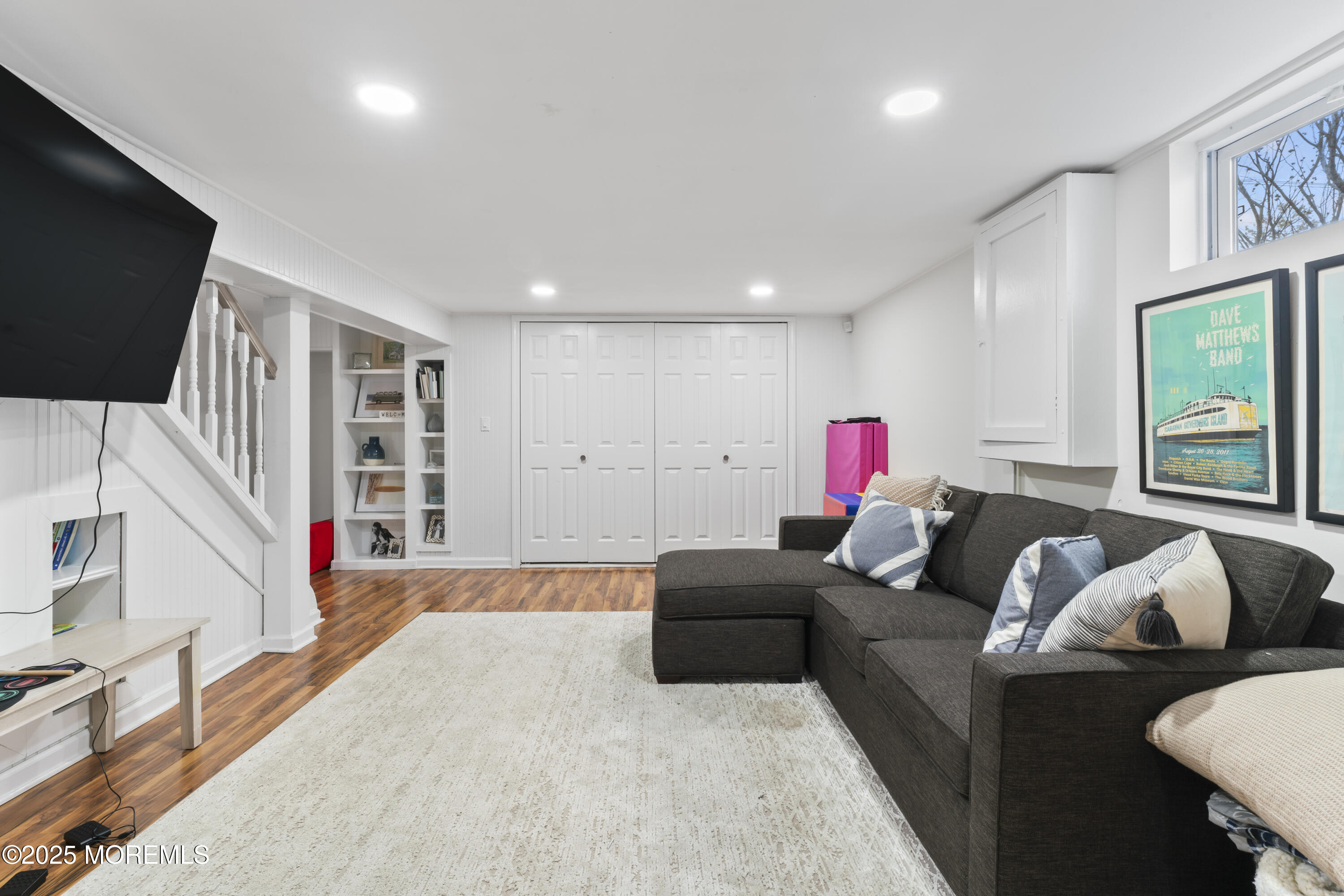 90 River Road Rumson, NJ 07760 - Photo 21 of 32 a living room with furniture and a flat screen tv