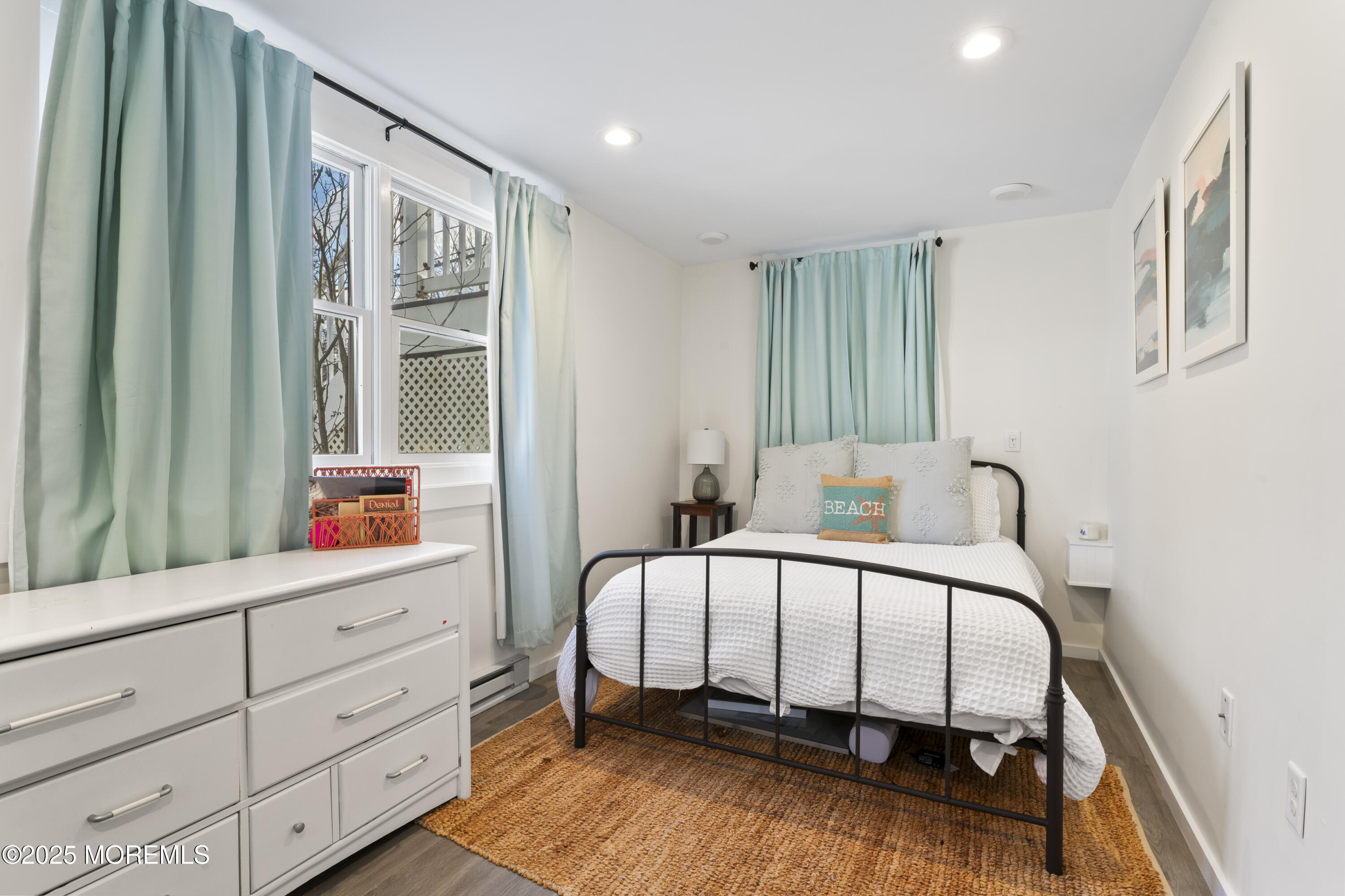 90 River Road Rumson, NJ 07760 - Photo 25 of 32 a bedroom with a bed and a dresser