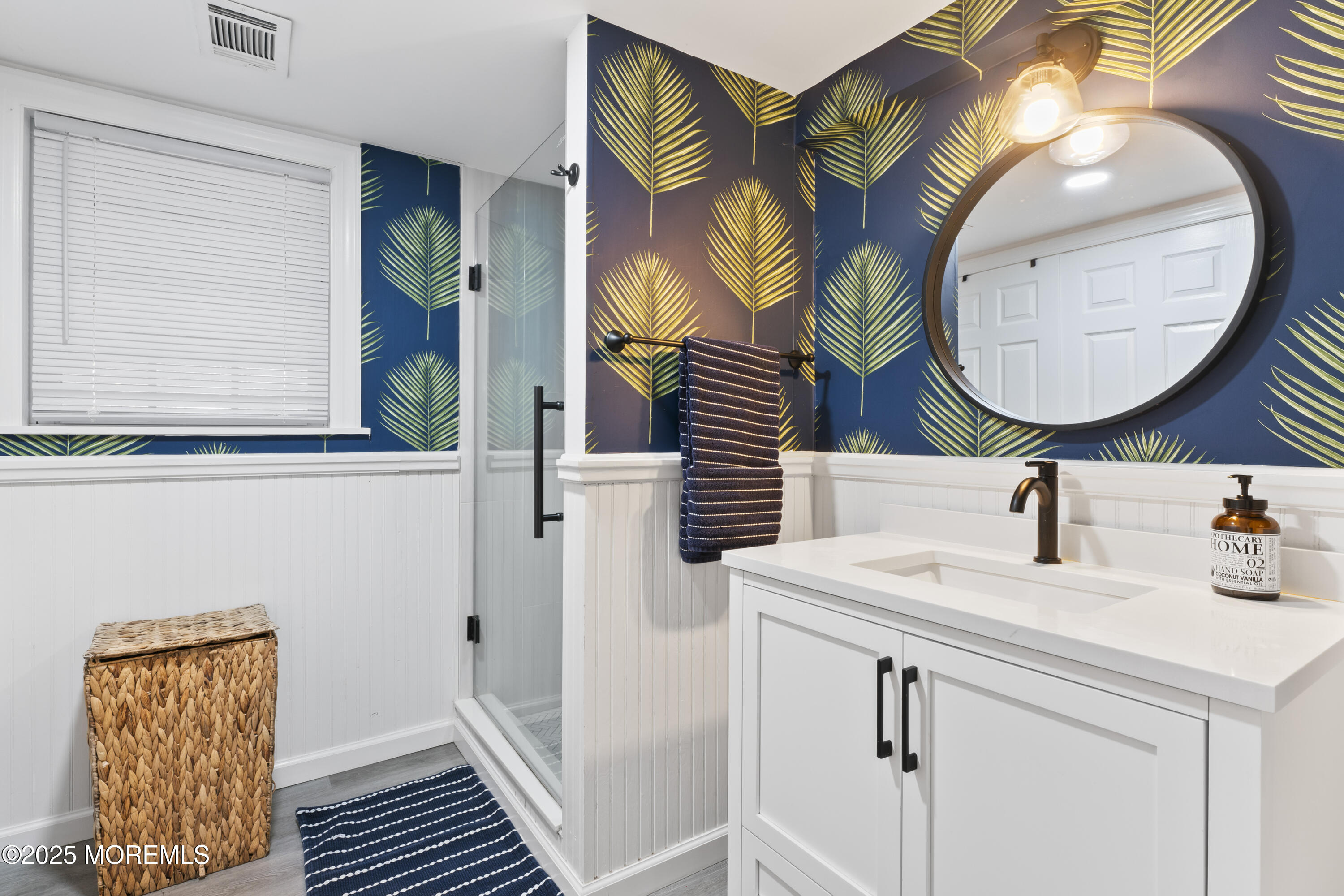 90 River Road Rumson, NJ 07760 - Photo 26 of 32 a bathroom with a sink and a mirror