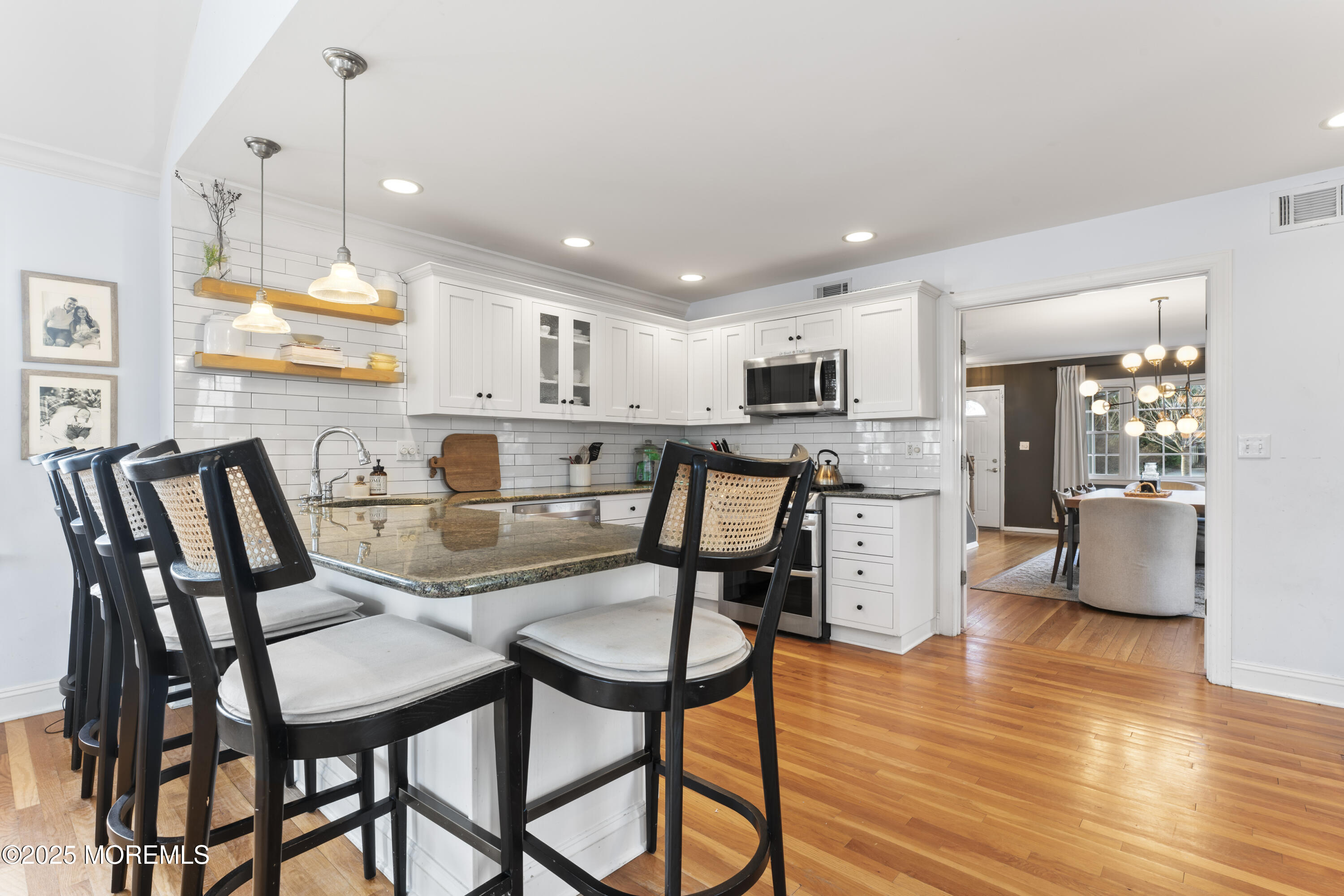 90 River Road Rumson, NJ 07760 - Photo 6 of 32 a view of a dining room with furniture and wooden floor