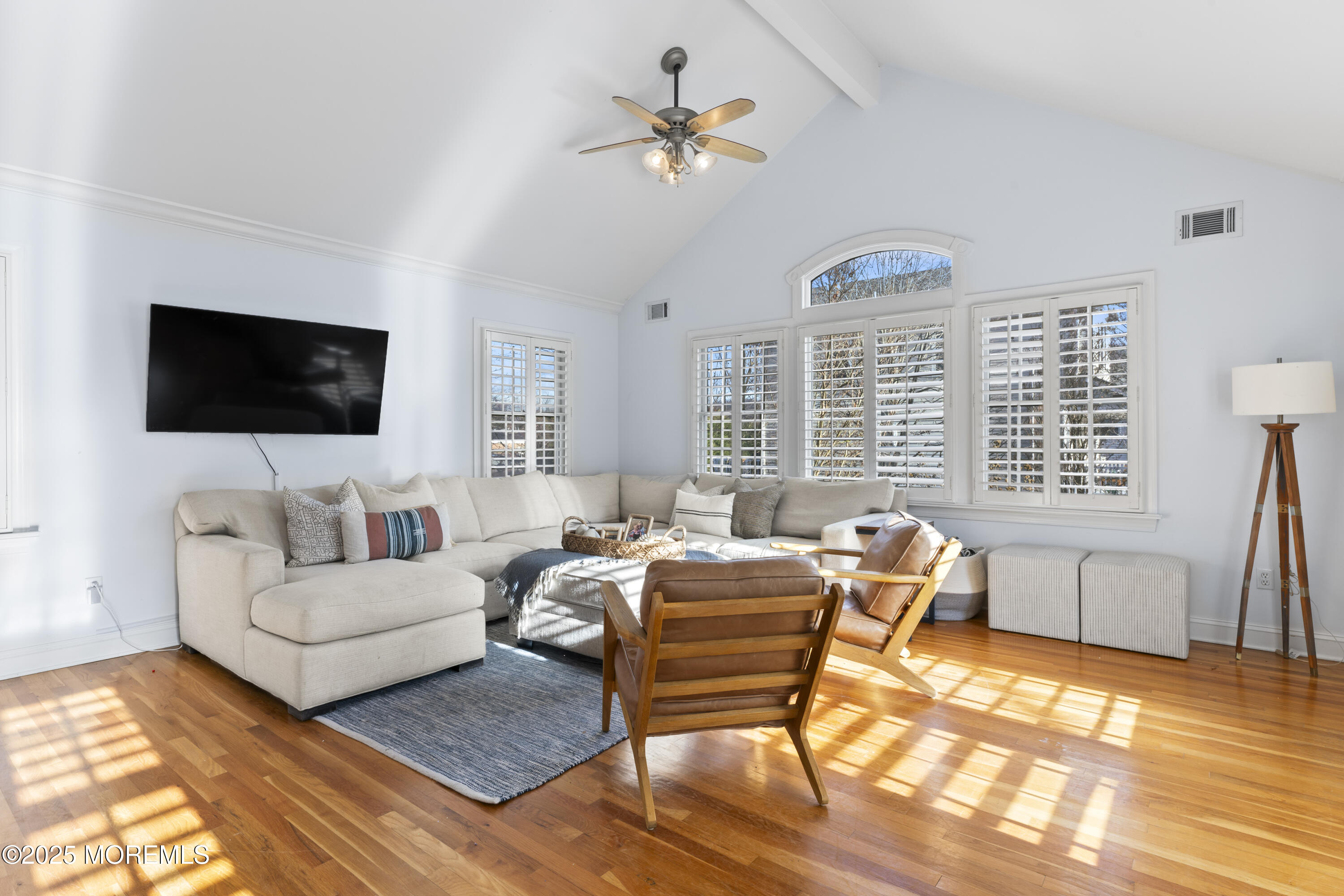 90 River Road Rumson, NJ 07760 - Photo 8 of 32 a living room with furniture a flat screen tv and a large window