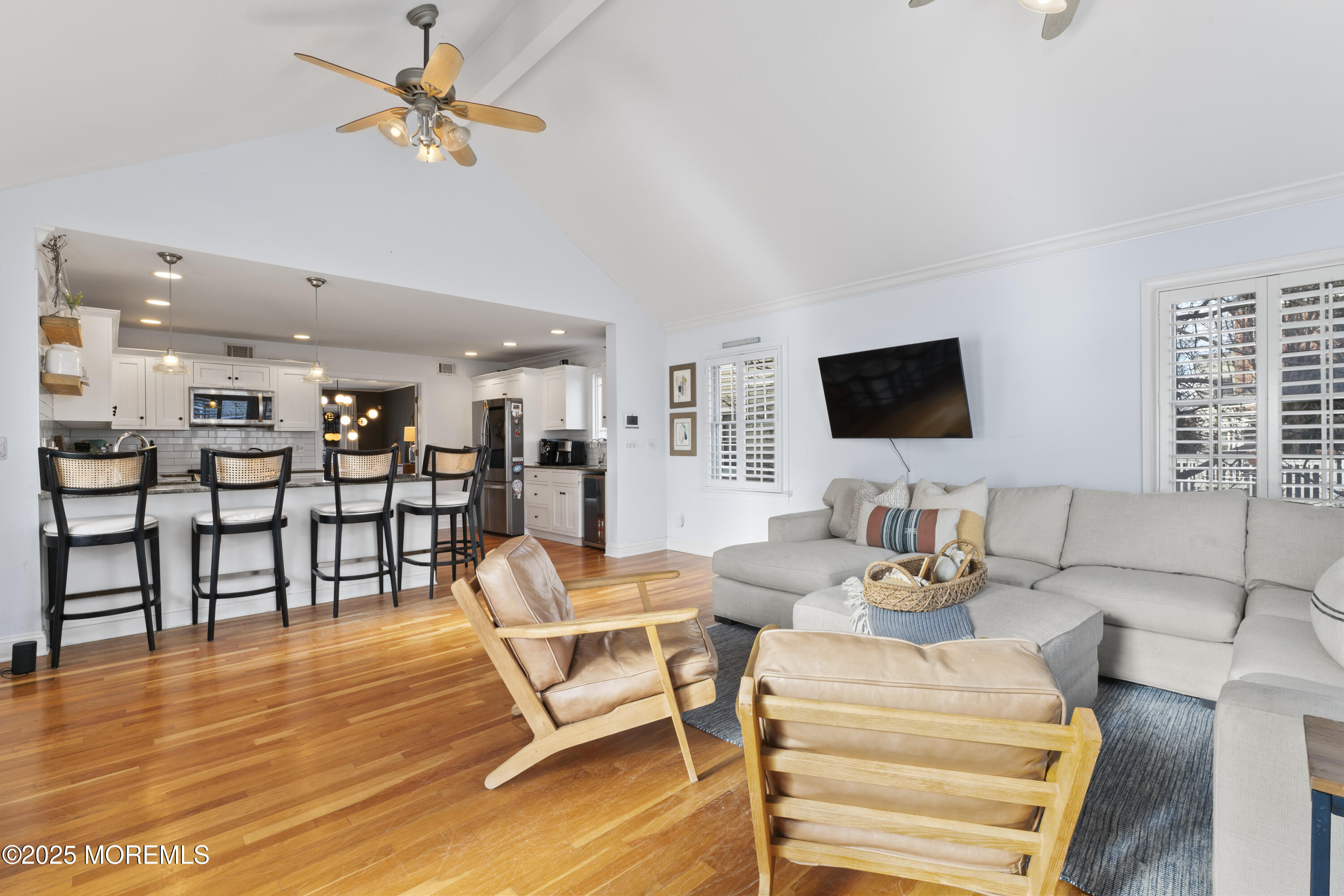 90 River Road Rumson, NJ 07760 - Photo 9 of 32 a view of a dining room with furniture and a flat screen tv