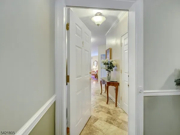 a view of room with window and hallway