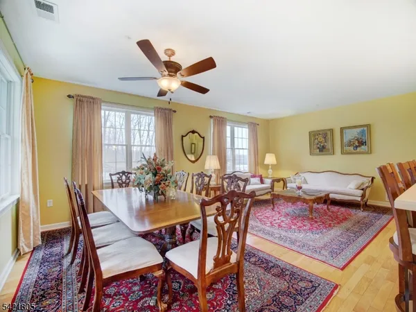a large kitchen with lots of counter space and sink
