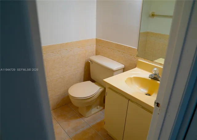 a bathroom with a sink and toilet