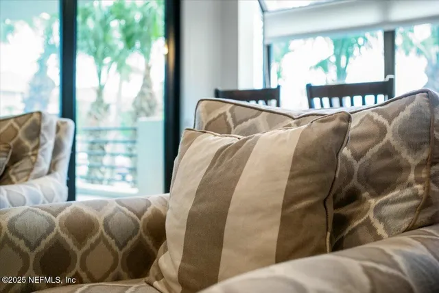 a kitchen with kitchen island a sink and a wooden floor