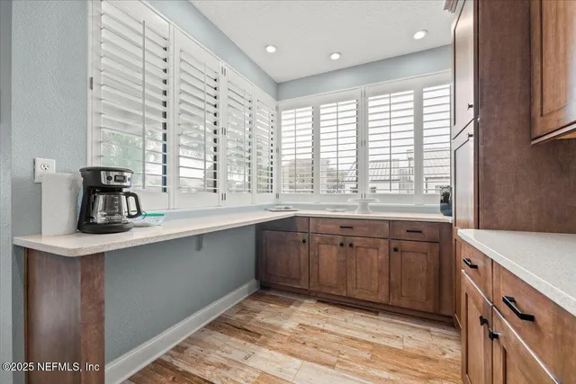 a bedroom with a bed and lamp