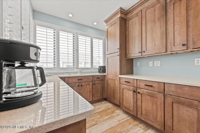 a spacious bathroom with a double vanity sink toilet and shower