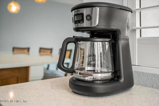 a view of a chairs and table in the terrace