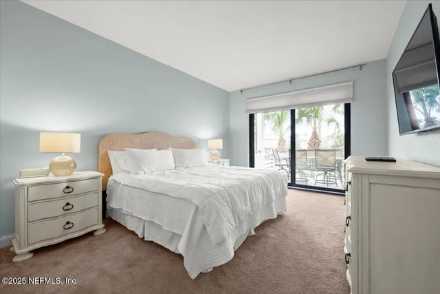a bathroom with a granite countertop toilet sink and mirror