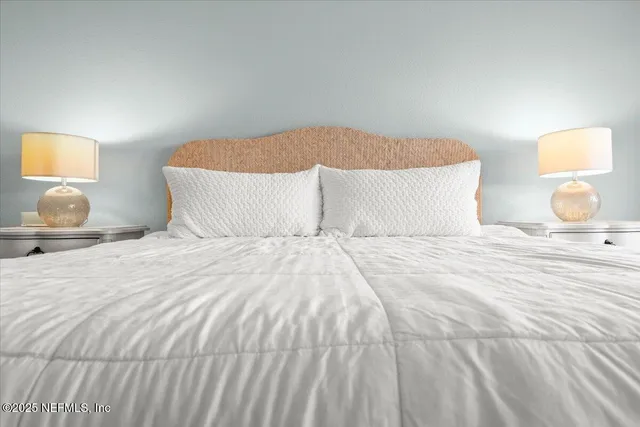 a white toilet sitting next to a shower curtain