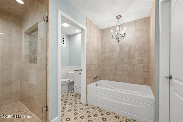 a front view of a house with a yard and a garage