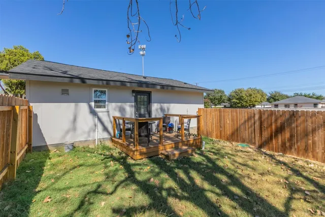 a backyard of a house with wooden fence