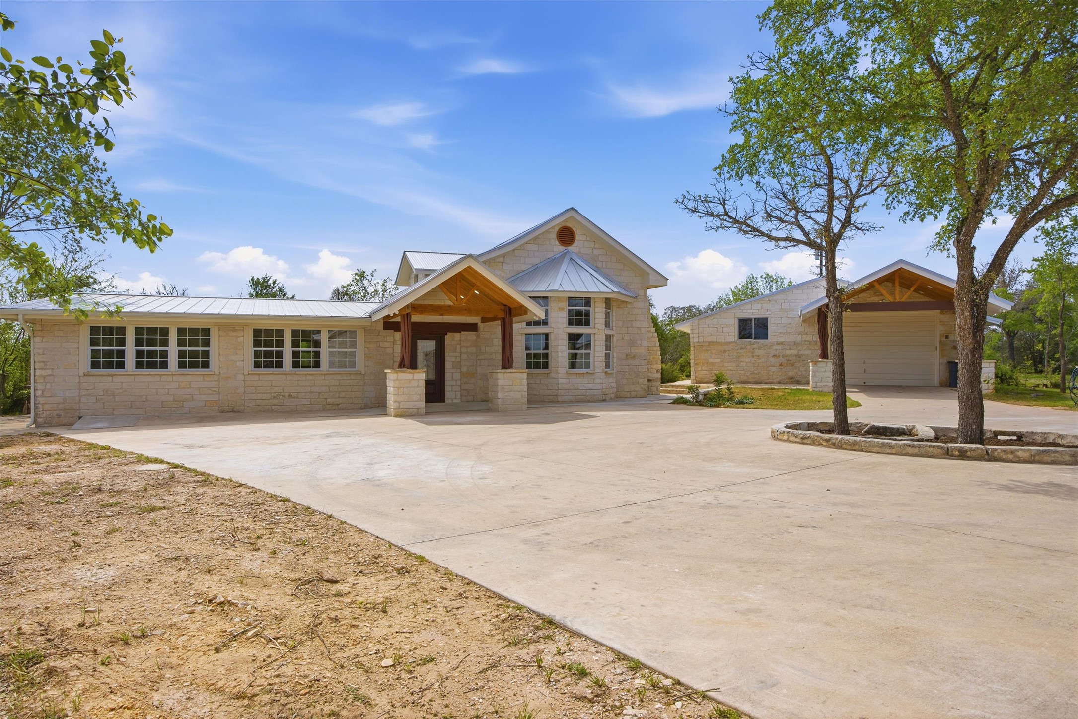 front view of a house with a trees