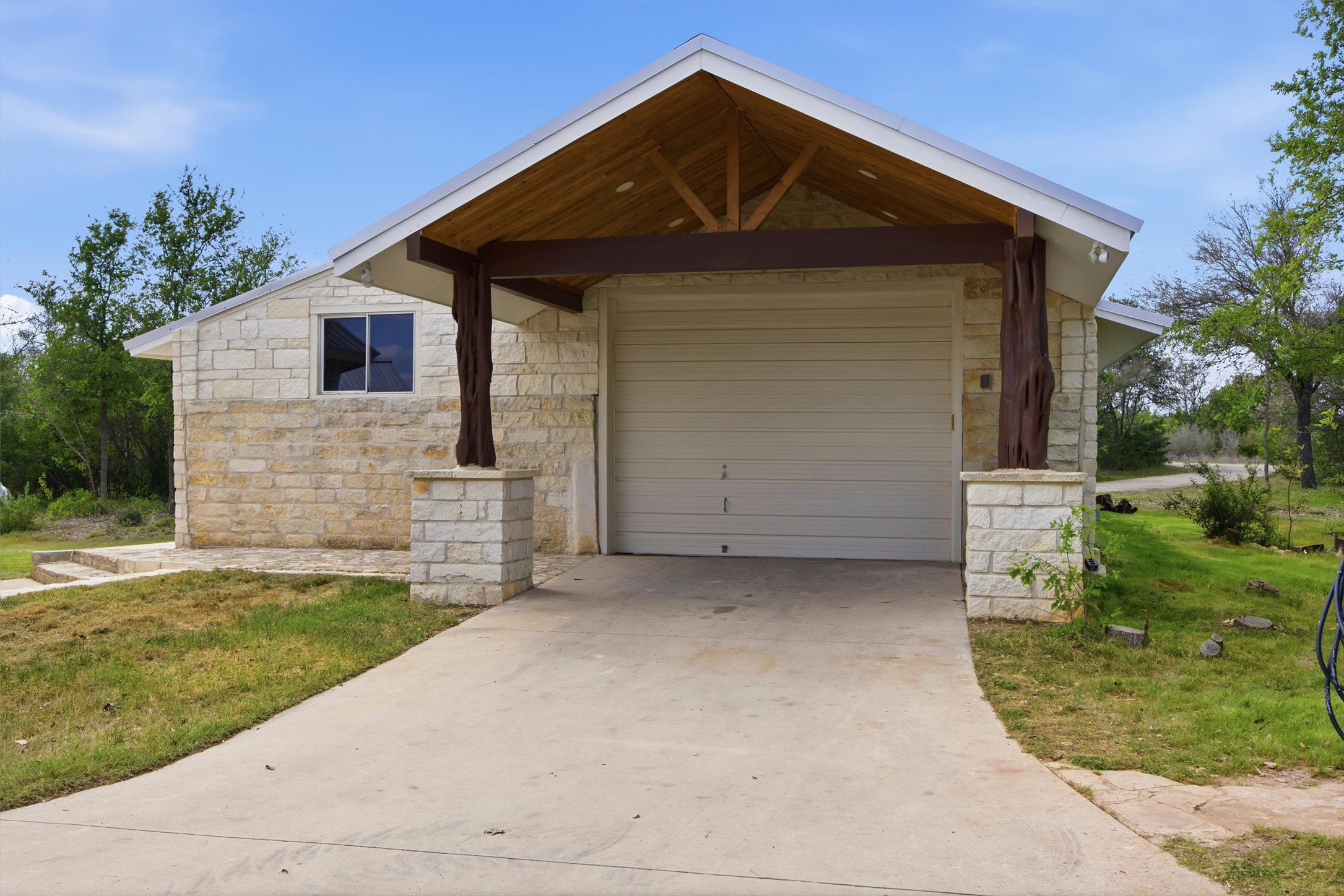 Undisclosed Address Buda, TX 78610 - Photo 18 of 19 a front view of a house with a yard