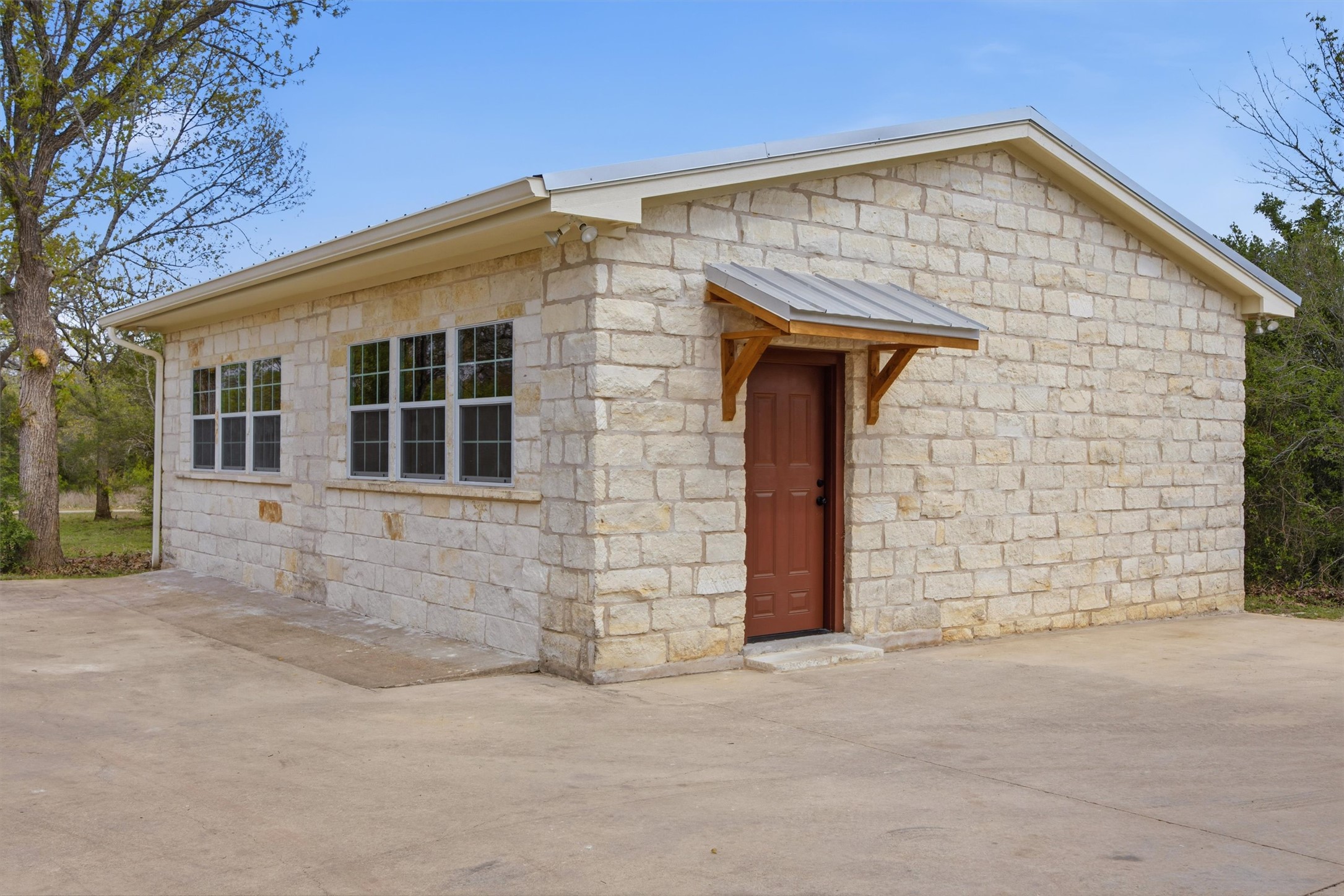 Undisclosed Address Buda, TX 78610 - Photo 19 of 19 front view of a house and an empty space