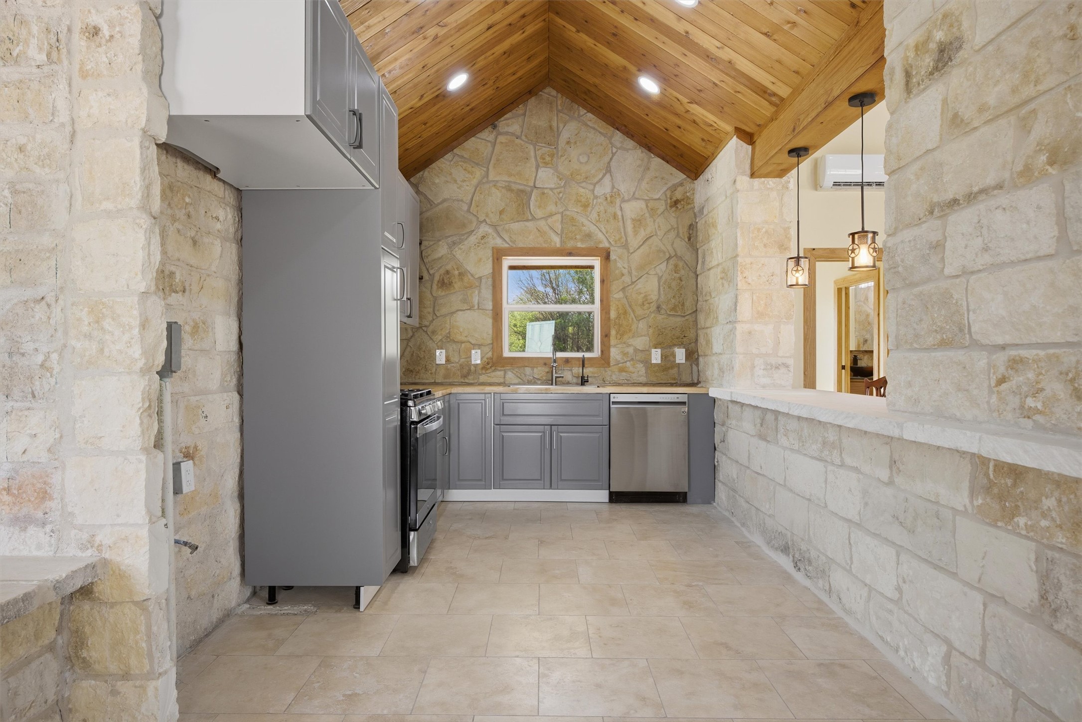 Undisclosed Address Buda, TX 78610 - Photo 5 of 19 a bathroom with a double vanity sink a mirror and a bathtub