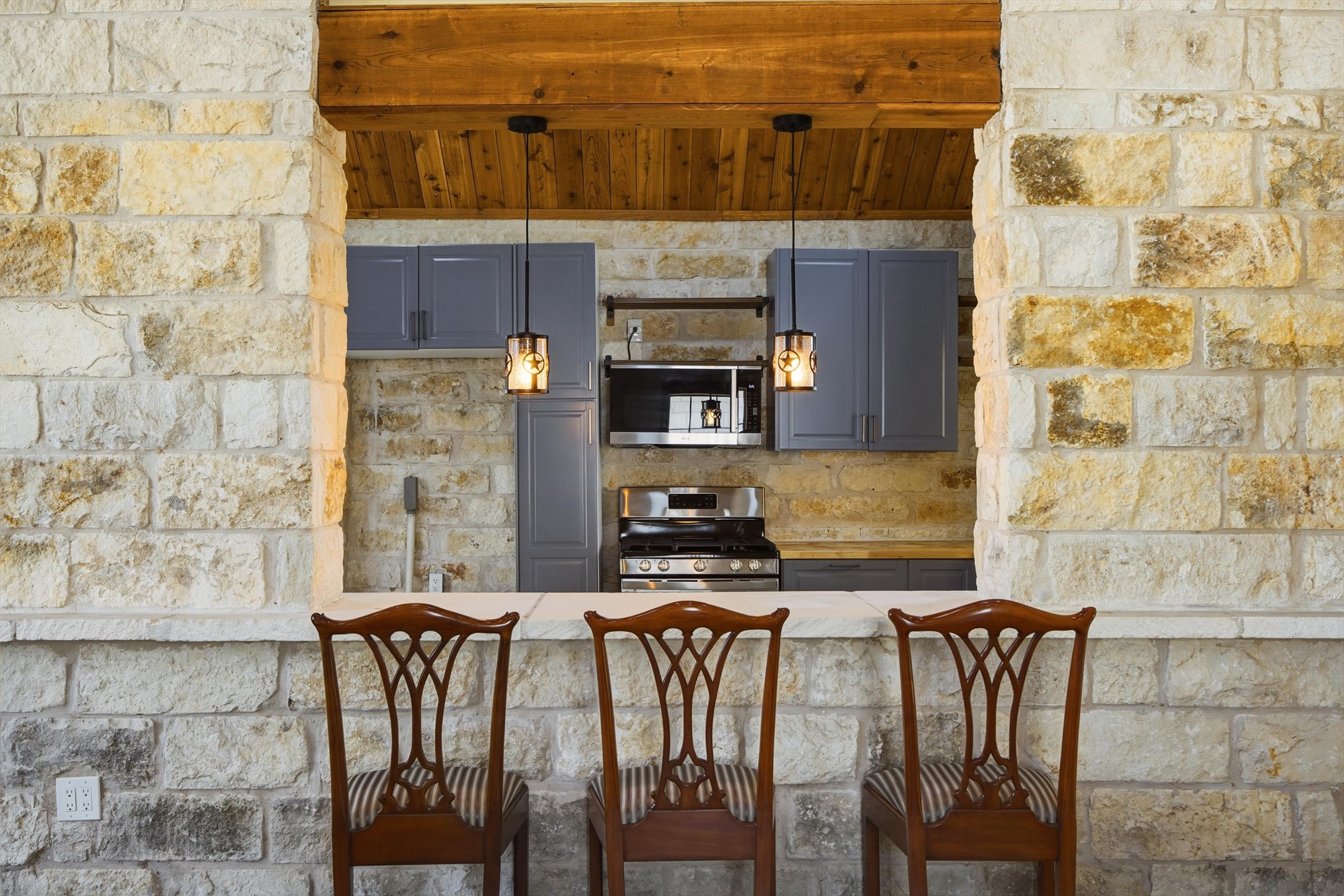 Undisclosed Address Buda, TX 78610 - Photo 6 of 19 a view of a dining room with furniture and a fireplace