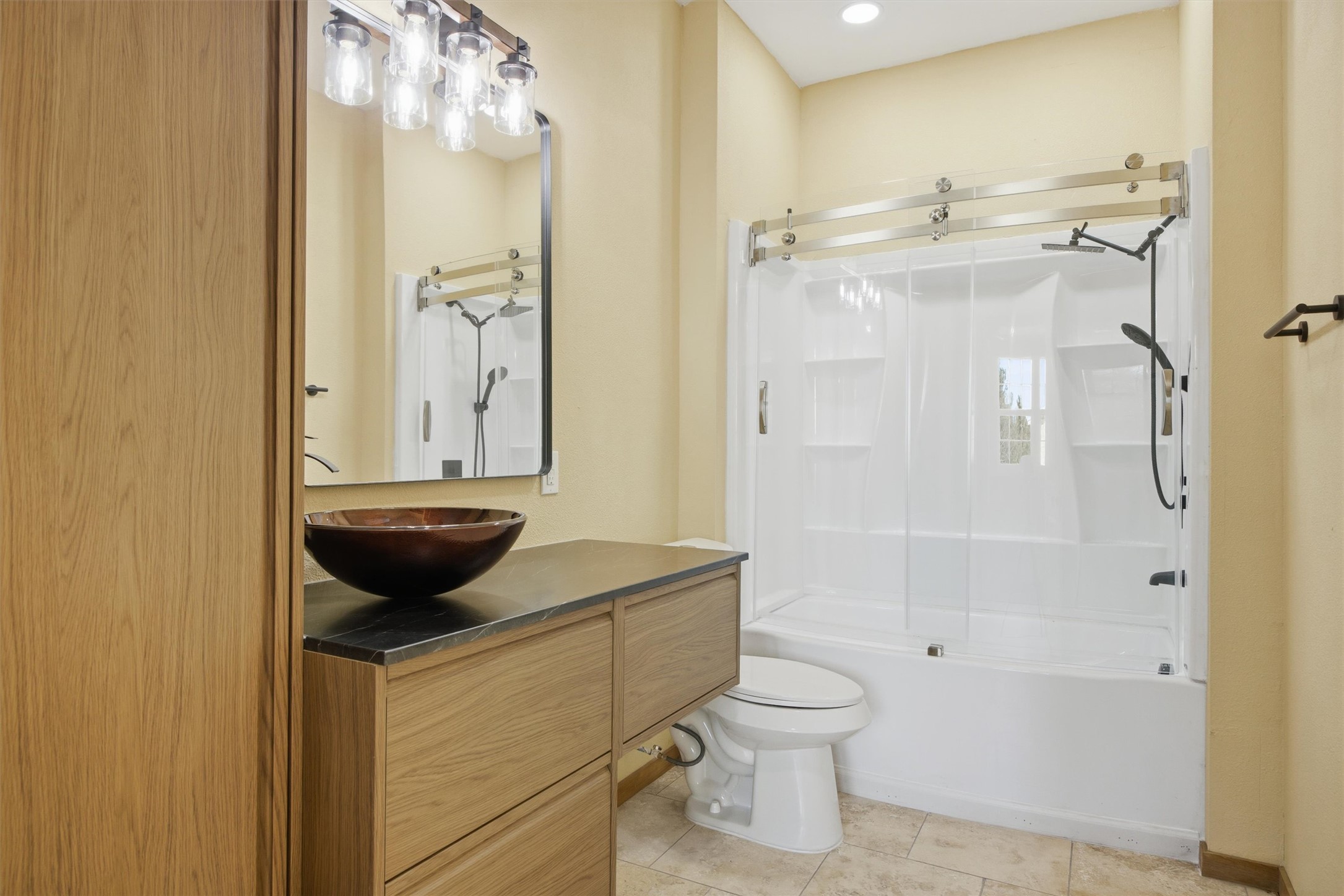 Undisclosed Address Buda, TX 78610 - Photo 9 of 19 a bathroom with a granite countertop sink a toilet and shower
