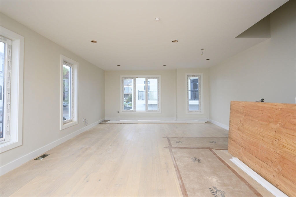 29 R Ashland Street, Unit 29R Boston, MA 02122 - Photo 18 of 22 a view of an empty room with a window