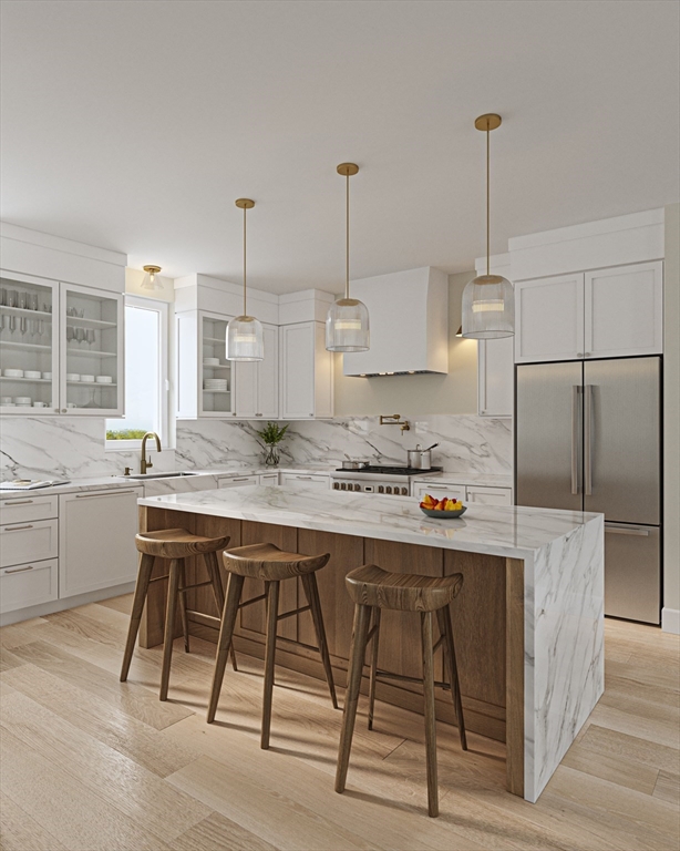 29 R Ashland Street, Unit 29R Boston, MA 02122 - Photo 2 of 22 a kitchen with kitchen island a stove a sink a counter top space and cabinets