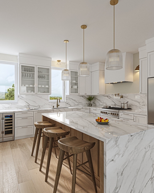 29 R Ashland Street, Unit 29R Boston, MA 02122 - Photo 4 of 22 a kitchen with stainless steel appliances granite countertop a stove a sink and a wooden floors