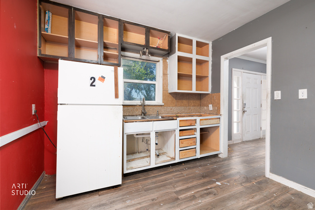 330 West 600th Street South Provo, UT 84601 - Photo 11 of 26 Kitchen space featuring wood-finish flooring and partial cabinetry