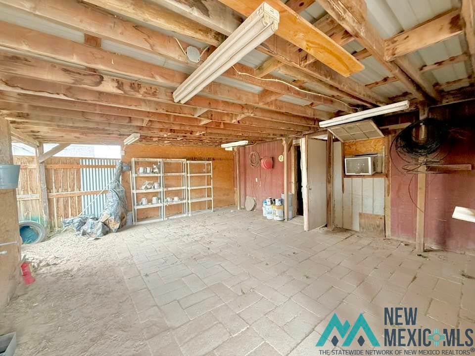 5404 Sioux Road Carlsbad, NM 88220 - Photo 84 of 100 Covered open-air structure featuring a partial brick paver floor and exposed wood beam ceiling
