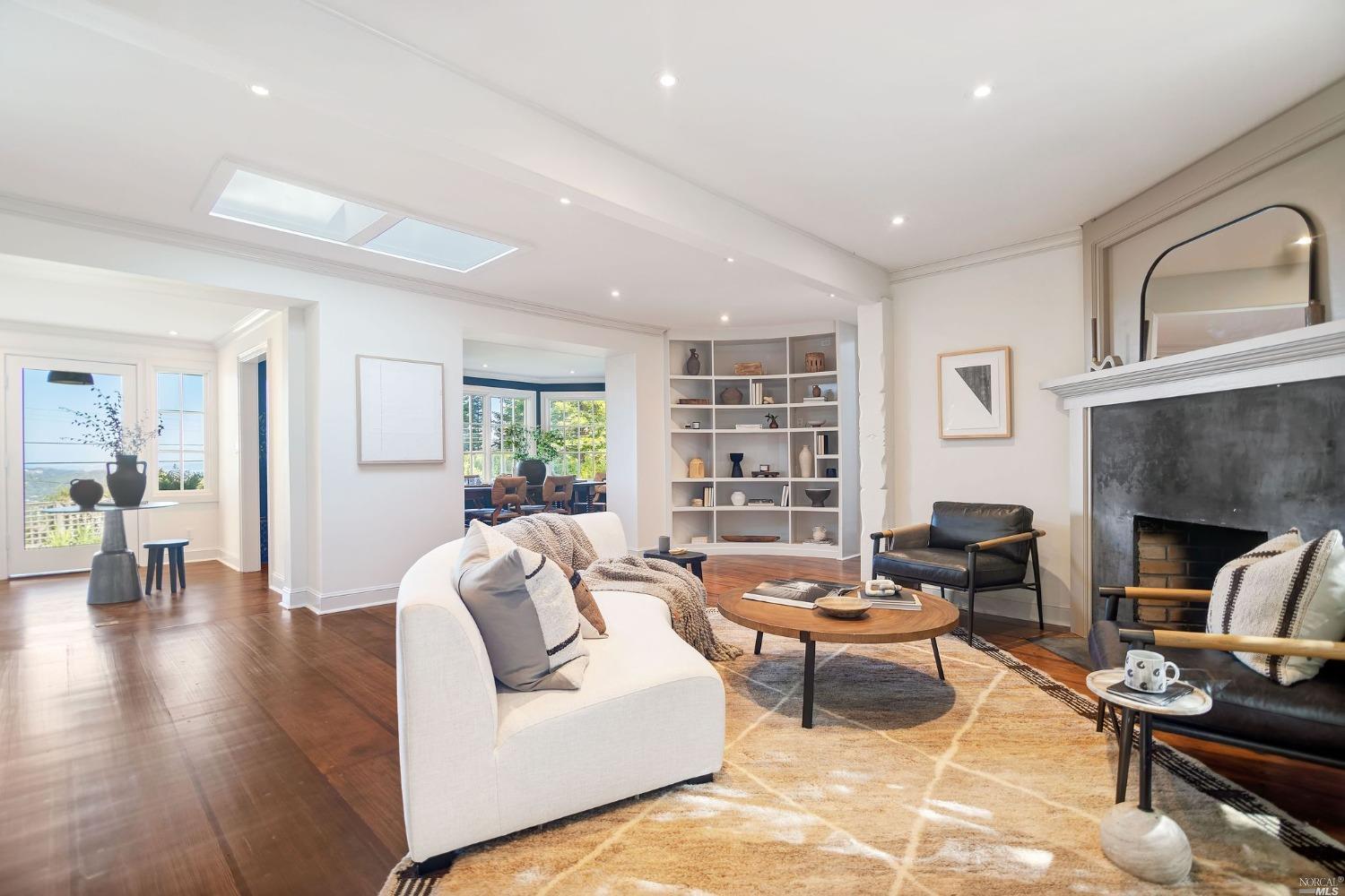 688 Sequoia Valley Road Mill Valley, CA 94941 - Photo 1 of 1 a living room with furniture and a fireplace