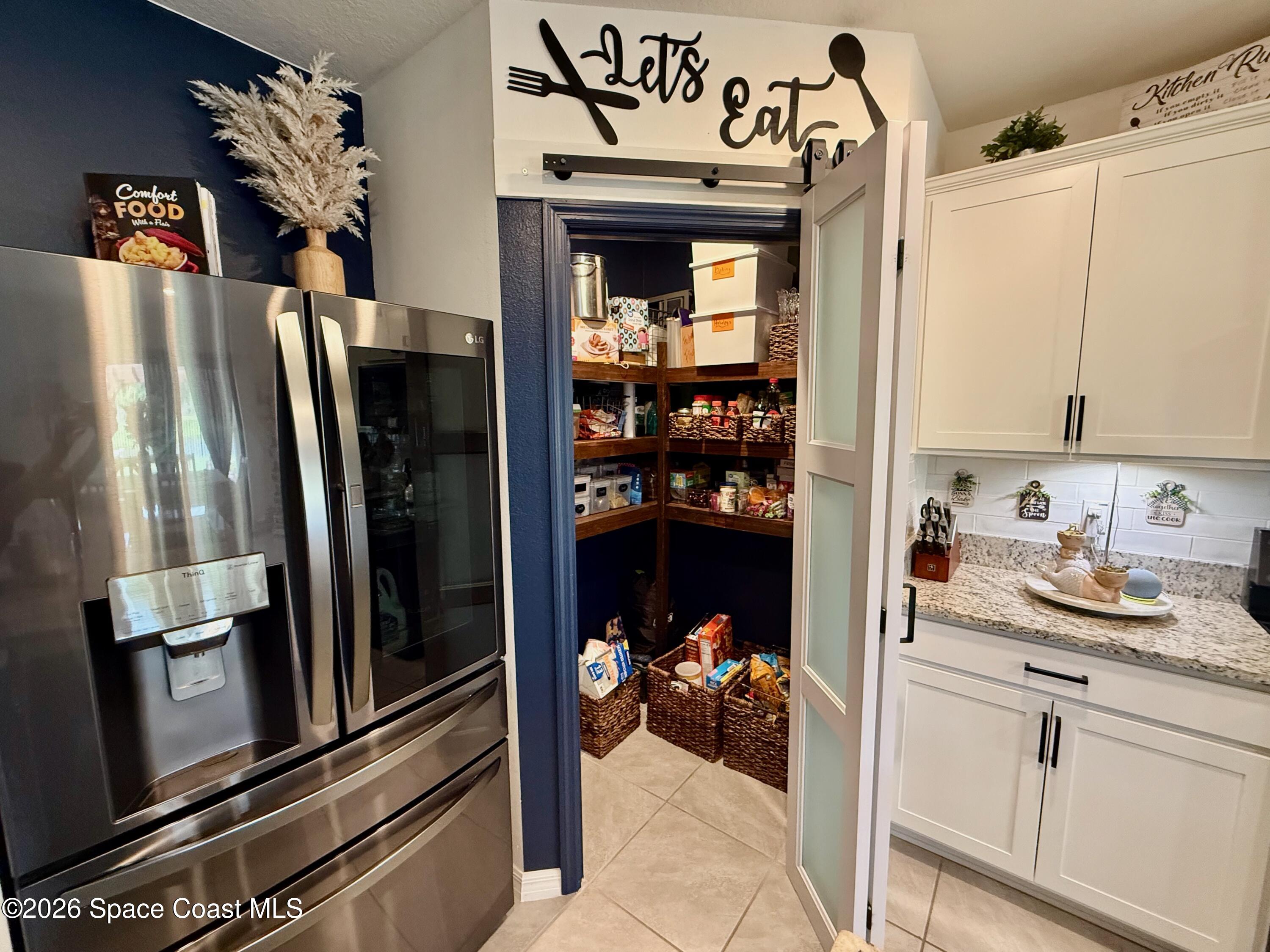 1873 Farmhouse Road Southeast Palm Bay, FL 32909 - Photo 7 of 35 custom walk-in pantry