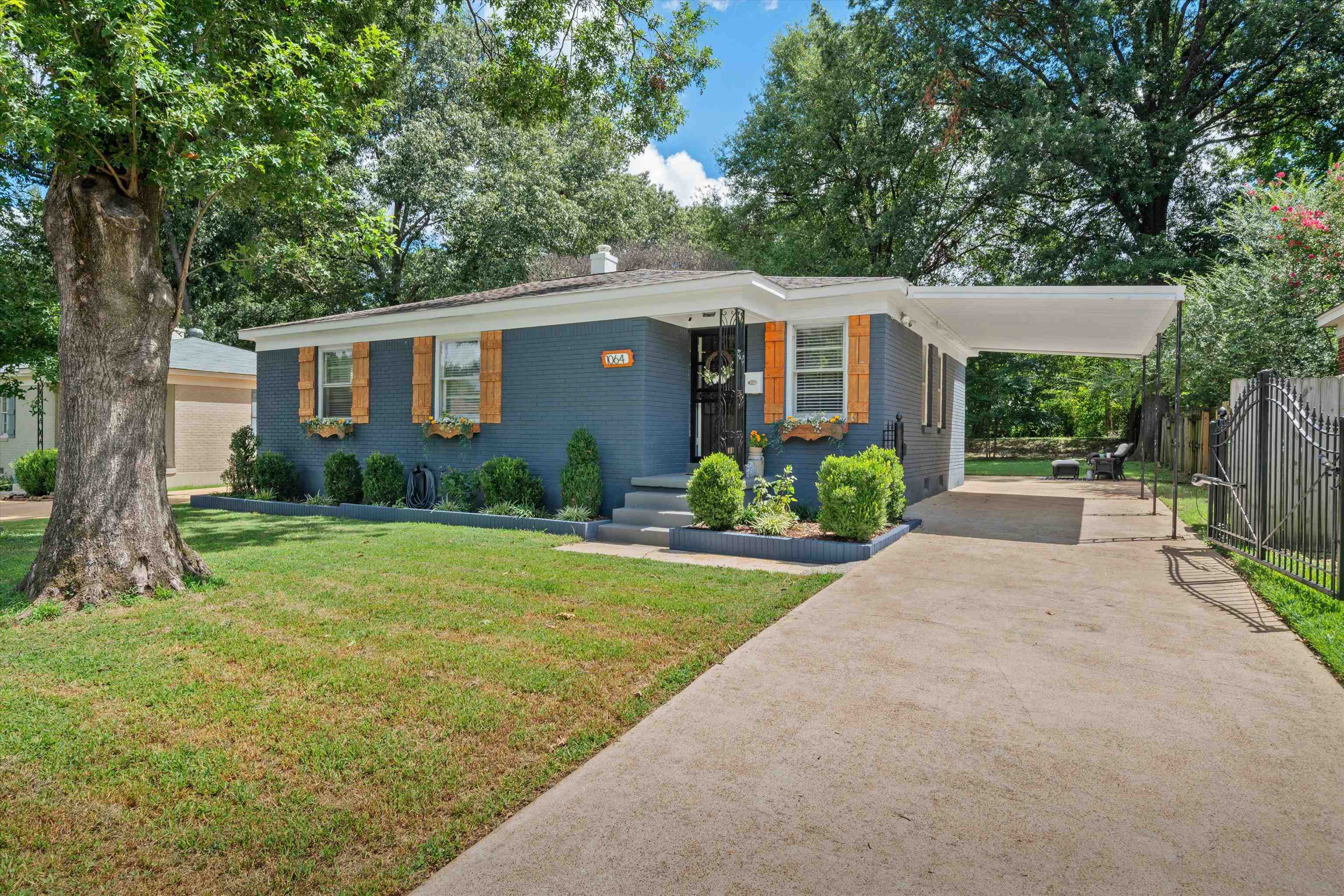 1064 Wilbec Road Memphis, TN 38117 - Photo 1 of 23 a front view of house with yard and green space