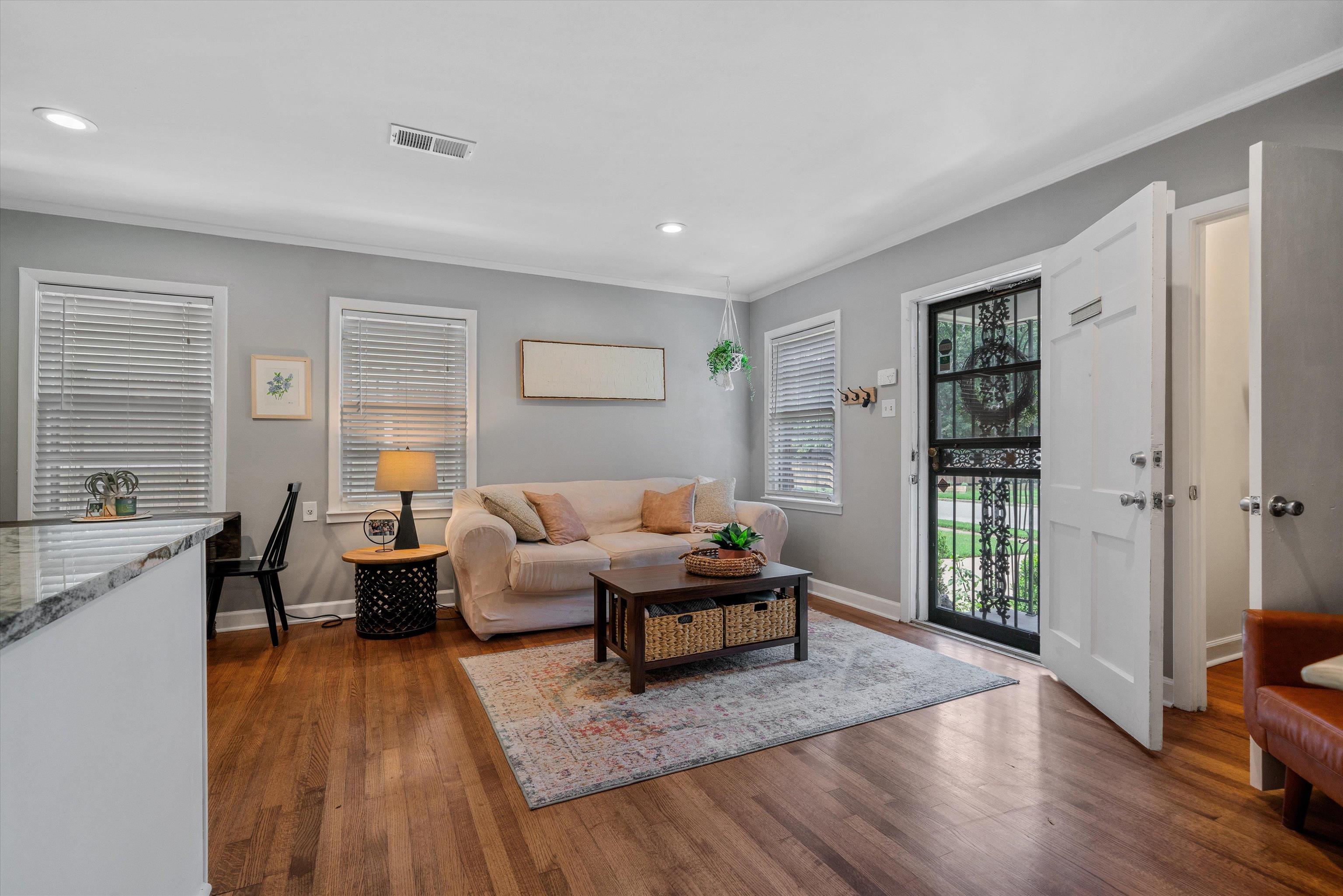 1064 Wilbec Road Memphis, TN 38117 - Photo 5 of 23 a living room with furniture large window and wooden floor