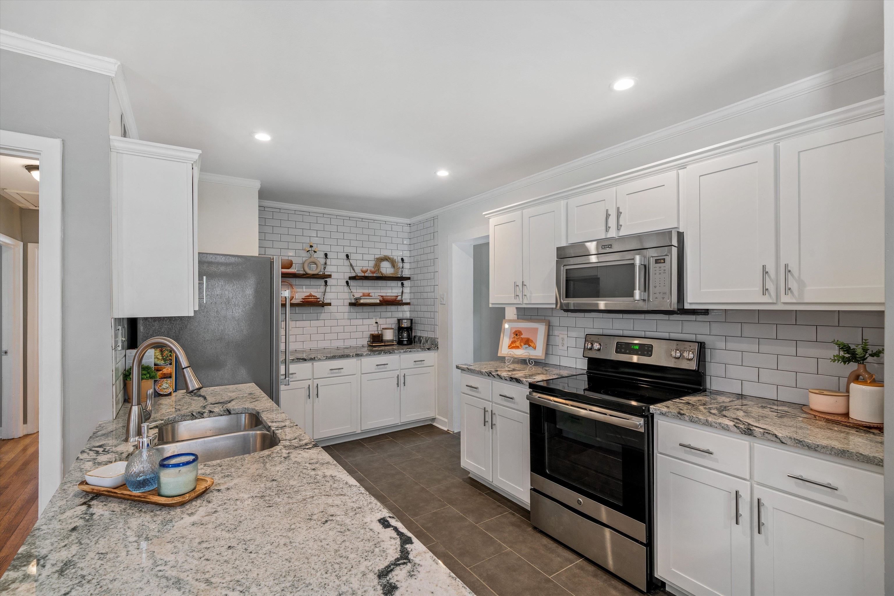 1064 Wilbec Road Memphis, TN 38117 - Photo 7 of 23 a kitchen with a sink appliances and cabinets