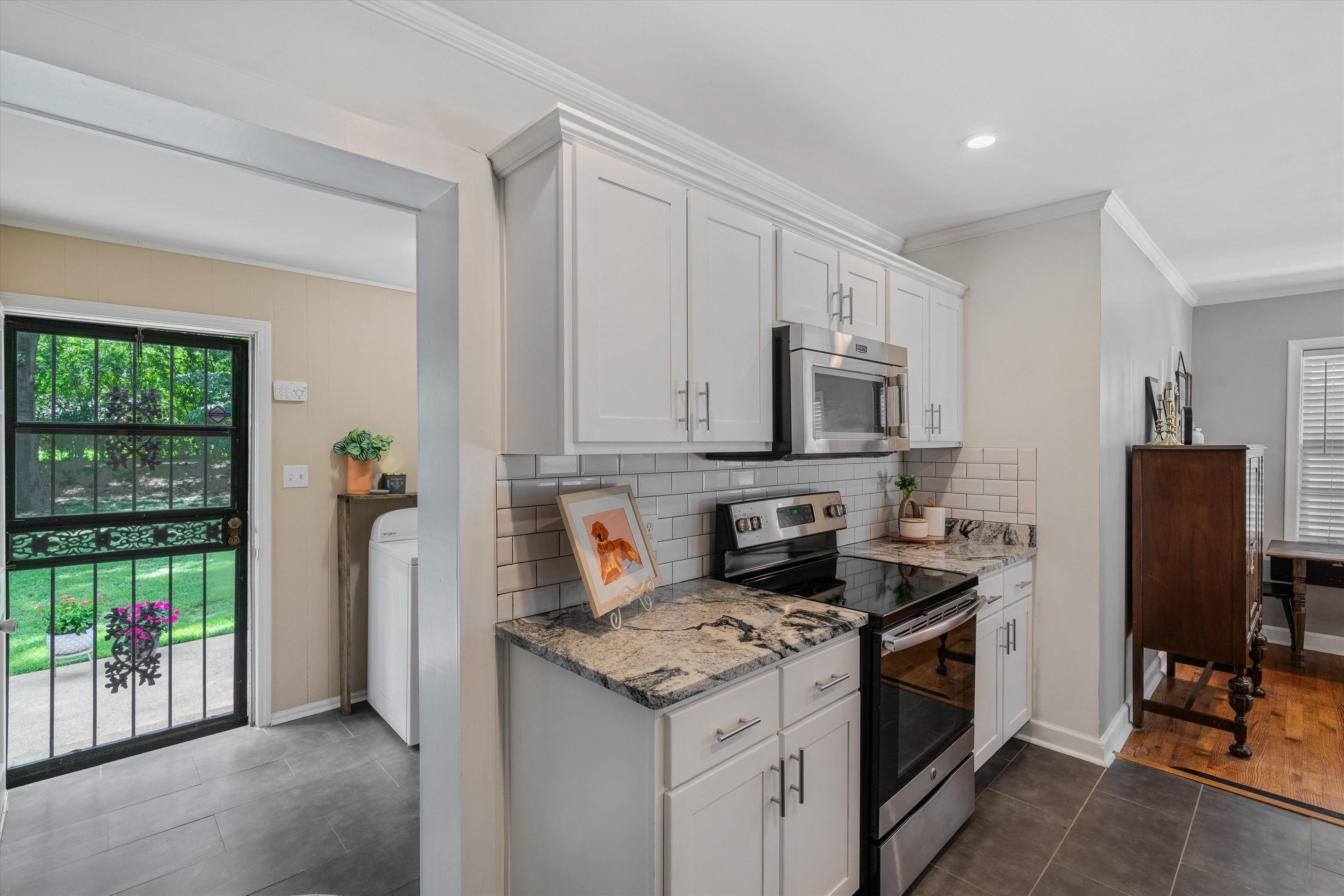 1064 Wilbec Road Memphis, TN 38117 - Photo 9 of 23 a kitchen with stainless steel appliances granite countertop a stove refrigerator sink and dishwasher