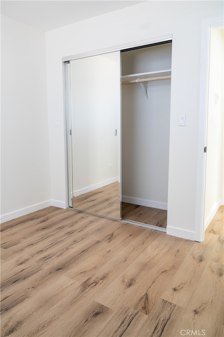 9350 Rhea Avenue Northridge, CA 91324 - Photo 14 of 20 an empty room with wooden floor and closet