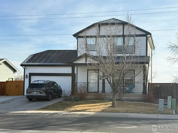 a view of a car in front of house