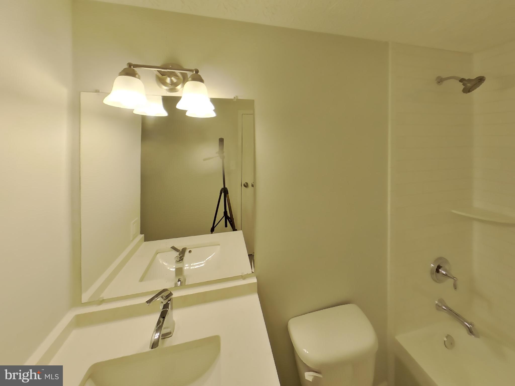 35 Greenleaf Road Baltimore, MD 21234 - Photo 11 of 14 a bathroom with a sink and mirror