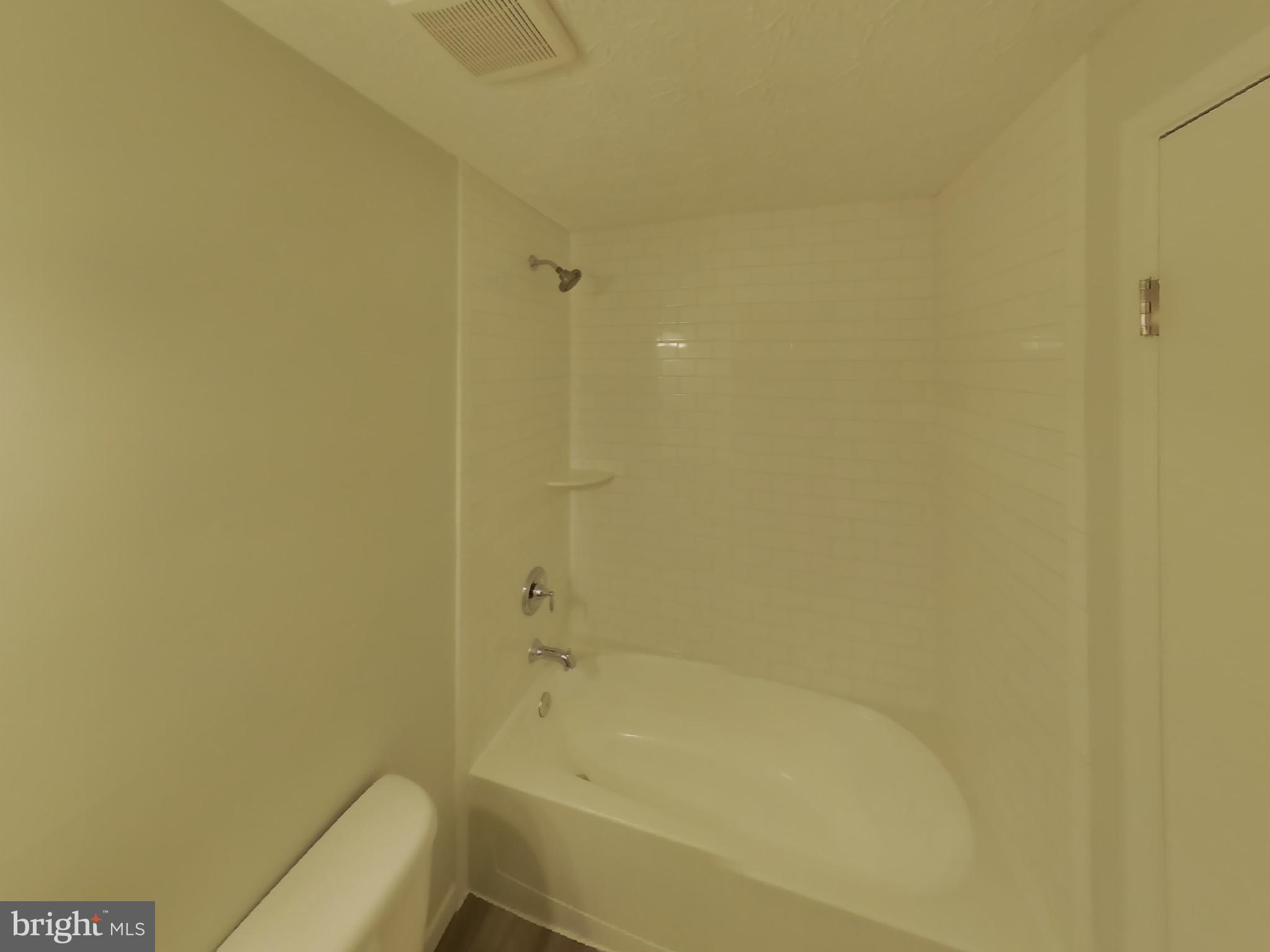 35 Greenleaf Road Baltimore, MD 21234 - Photo 12 of 14 a bathroom with a bathtub and shower