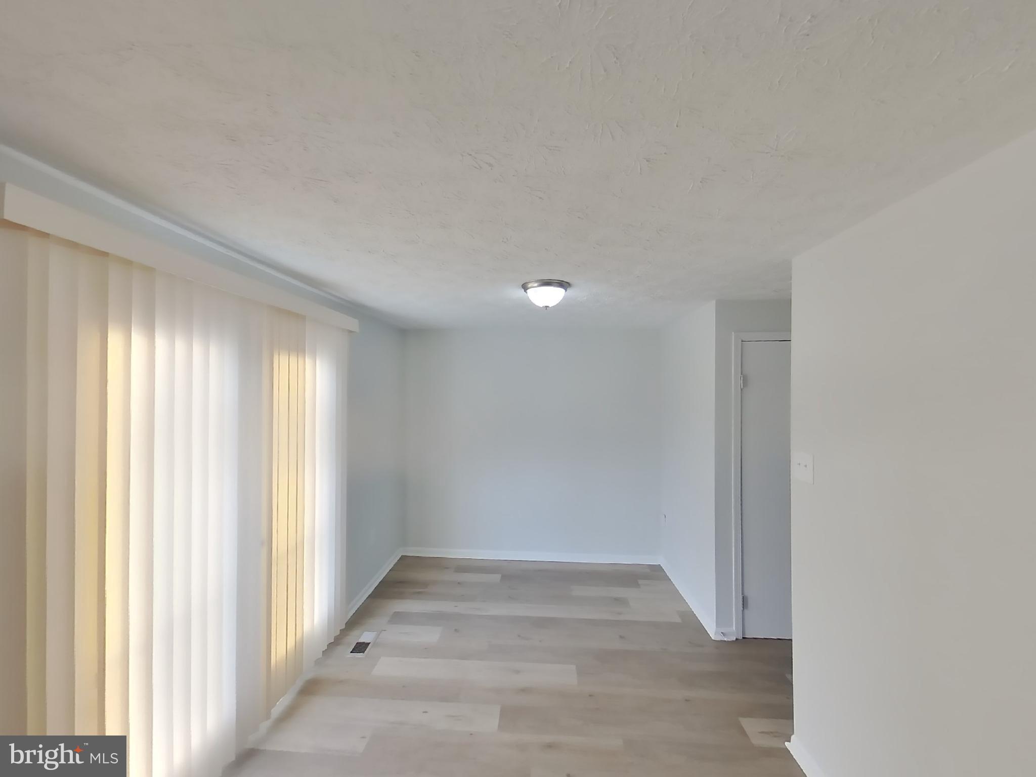 35 Greenleaf Road Baltimore, MD 21234 - Photo 5 of 14 a view of an empty room and window