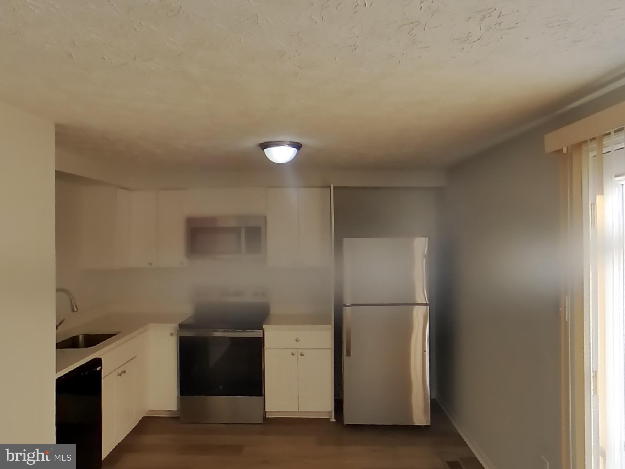 35 Greenleaf Road Baltimore, MD 21234 - Photo 6 of 14 a kitchen with a refrigerator and a stove