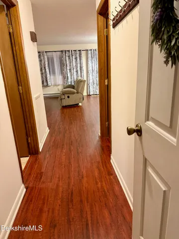 a large bedroom with a bed and furniture