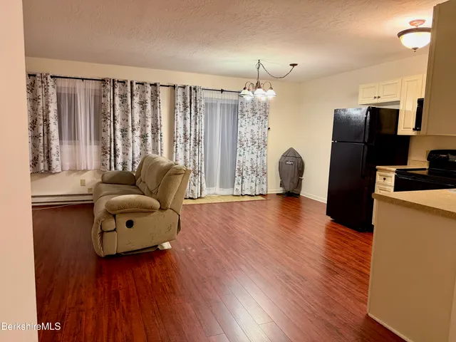a bathroom with a toilet a sink and shower