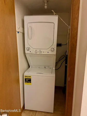 a kitchen with stainless steel appliances granite countertop a refrigerator a stove top oven a sink and dishwasher