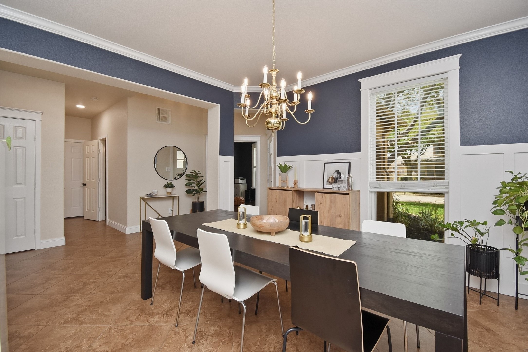 5615 Edgewood Pl Drive Spring, TX 77379 - Photo 13 of 48 Bright dining area with large window, detailed trim work and an open layout that connects seamlessly to the main living spaces.