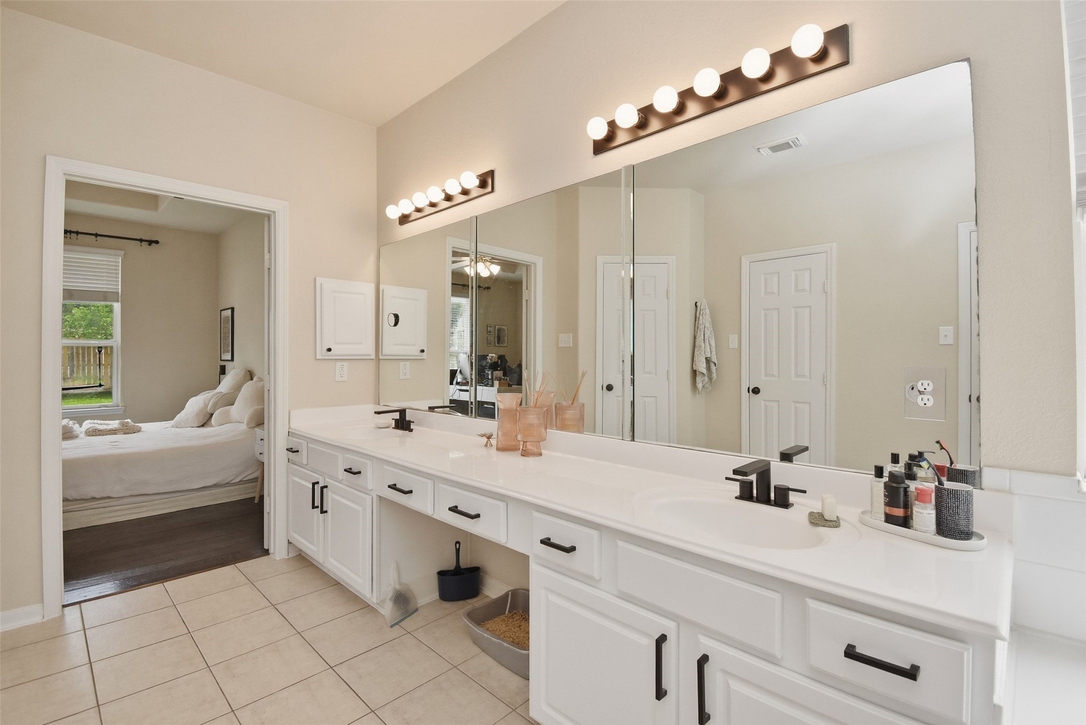 5615 Edgewood Pl Drive Spring, TX 77379 - Photo 29 of 48 Spa-like primary bath featuring a soaking tub, separate glass-enclosed shower and a bright, airy layout.