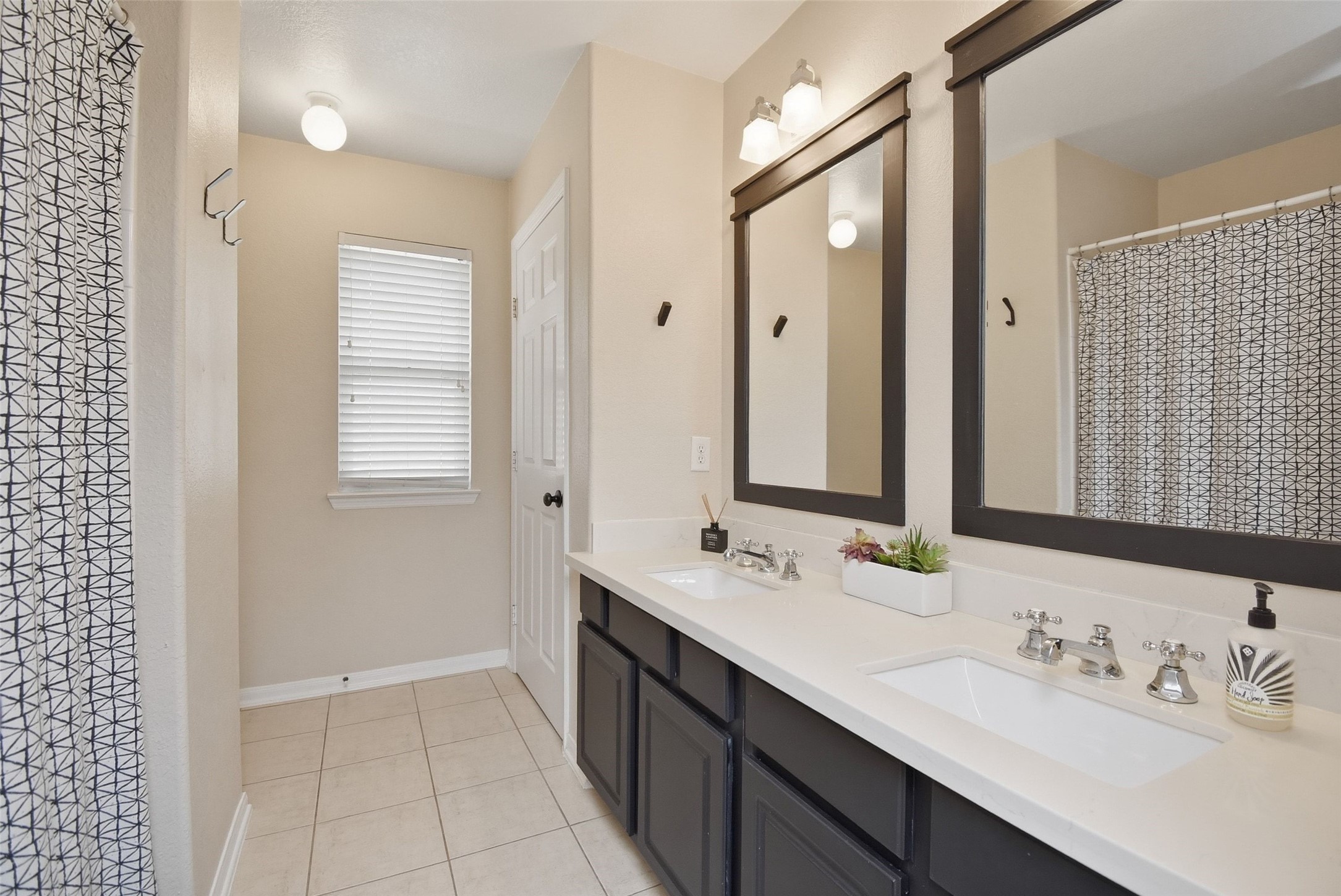 5615 Edgewood Pl Drive Spring, TX 77379 - Photo 38 of 48 Well-appointed upstairs bathroom with dual sinks, generous counter space and a functional layout ideal for shared use.