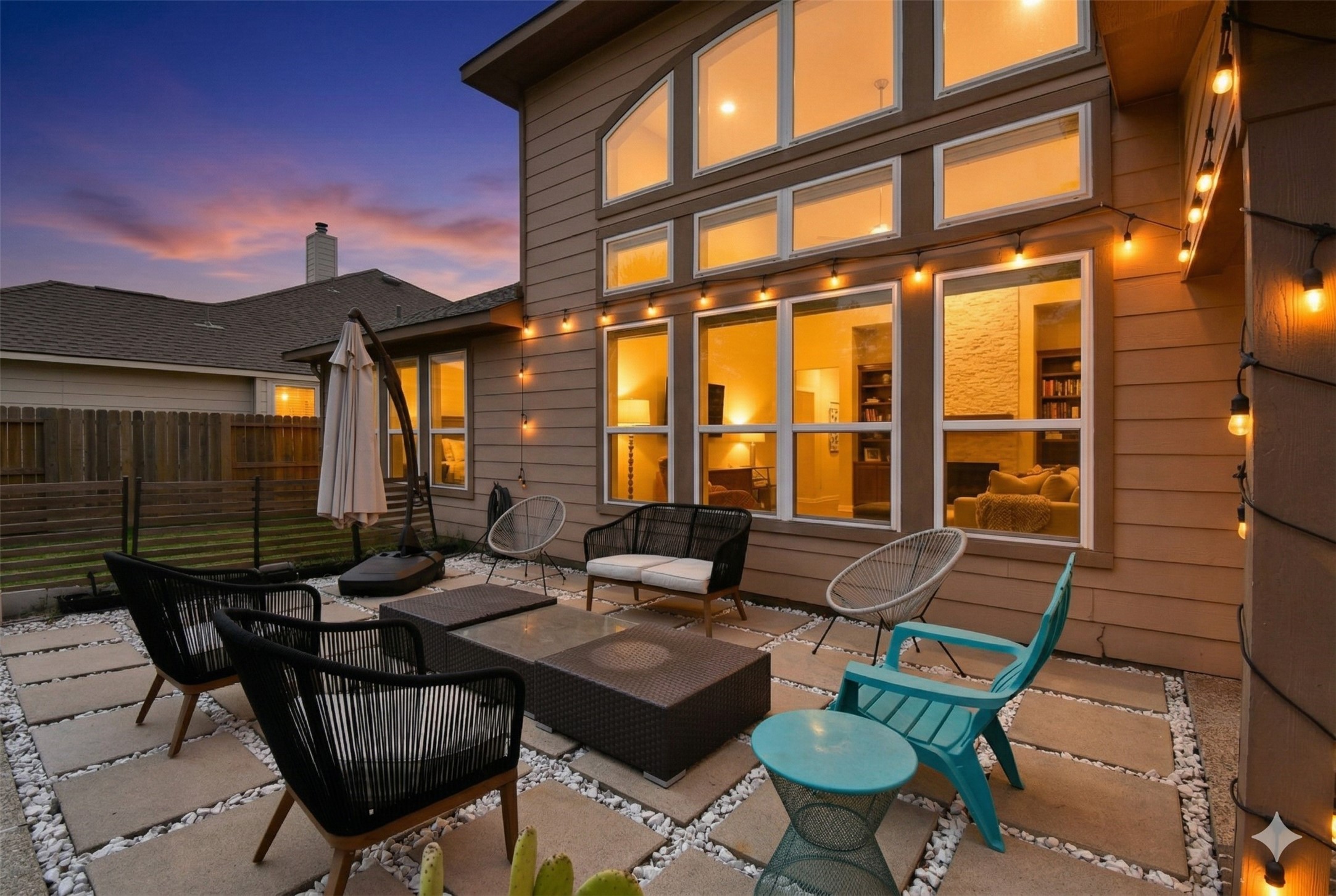 5615 Edgewood Pl Drive Spring, TX 77379 - Photo 48 of 48 Stunning rear elevation showcasing soaring windows, warm interior glow and seamless connection to the outdoor living spaces.