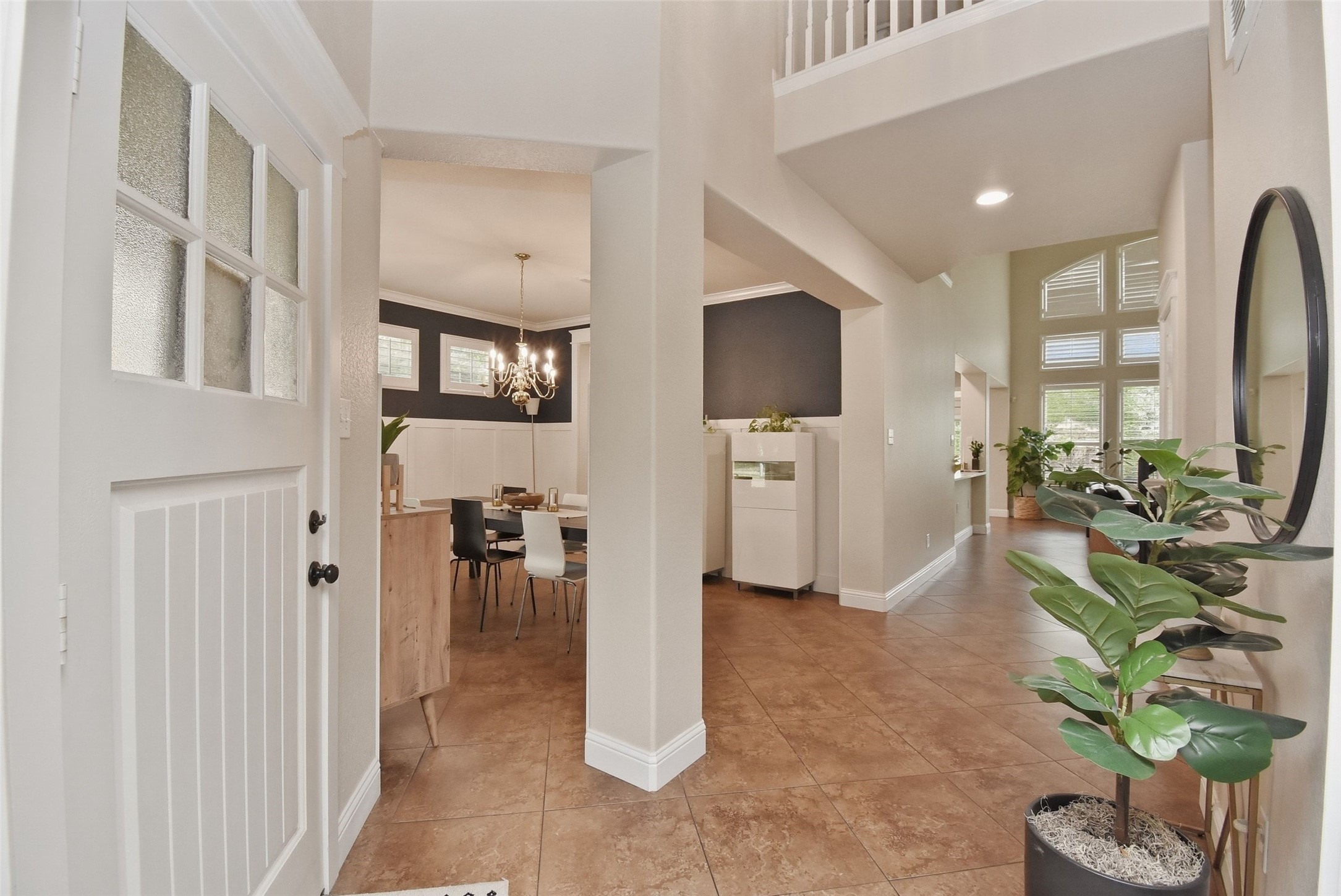 5615 Edgewood Pl Drive Spring, TX 77379 - Photo 9 of 48 Open entry and hallway layout showcasing high ceilings, architectural details and a seamless flow into the main living areas.